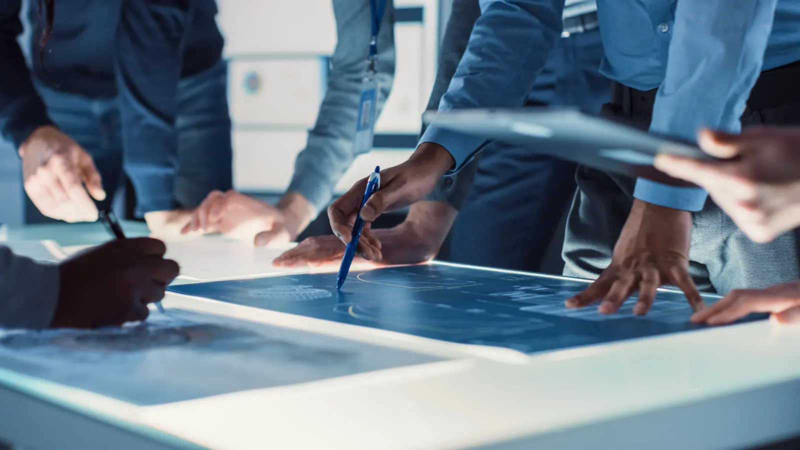 A team working together around a digital table